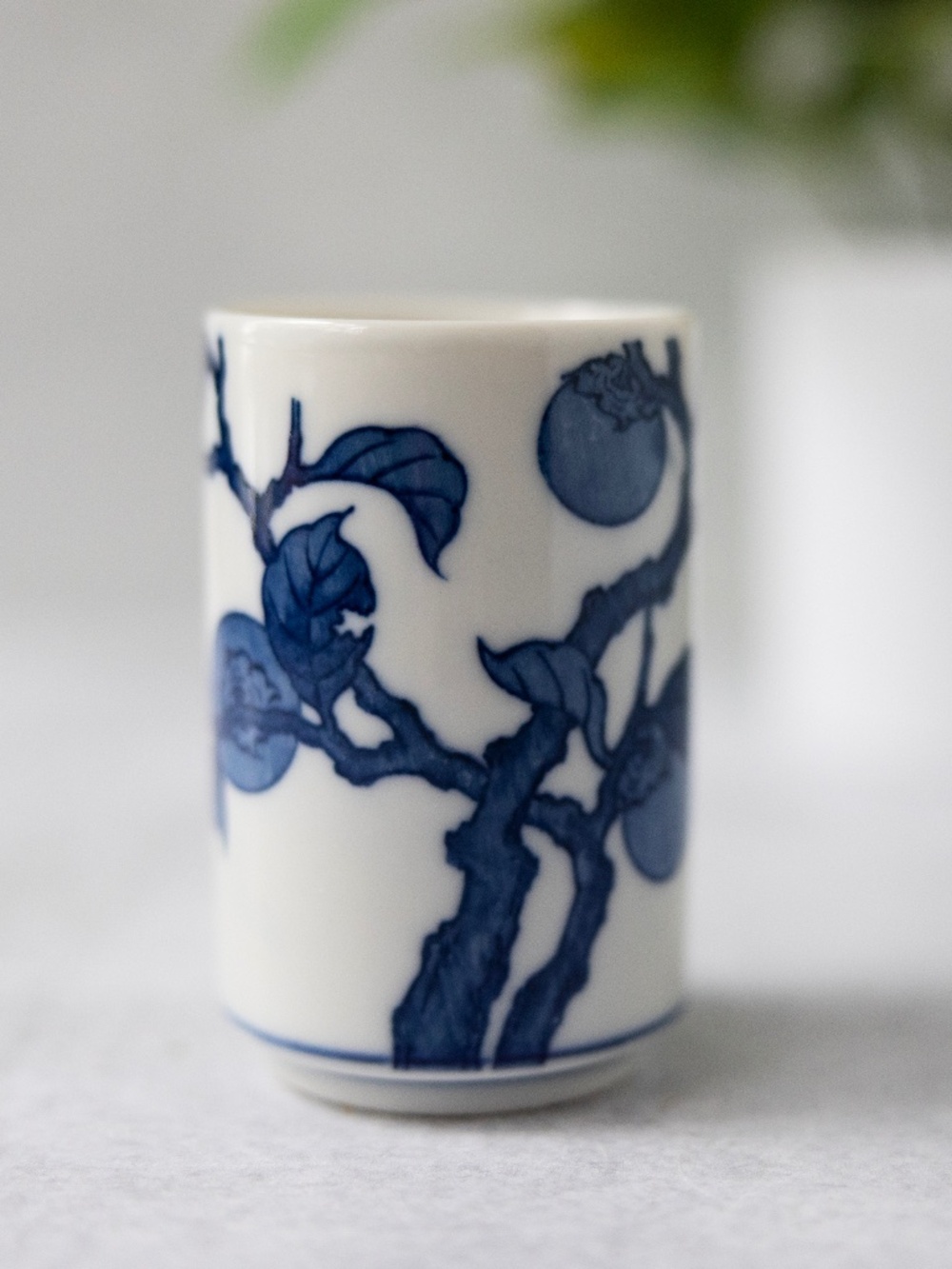Vintage Otagiri blue white ceramic persimmon tea cup or small vase 3 3/8" tall